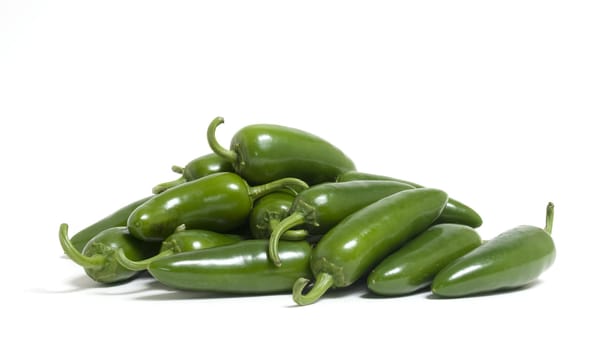 A bunch of hot jalapeno peppers on white background