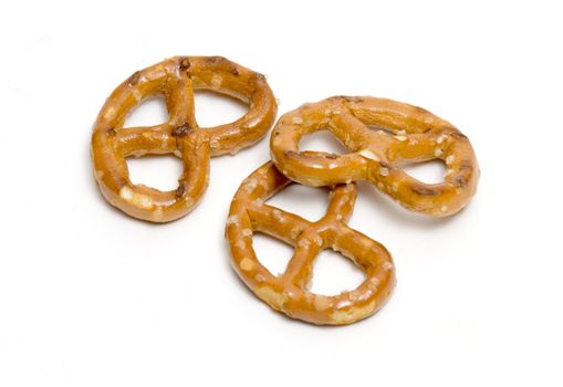 Three pretzels on white background