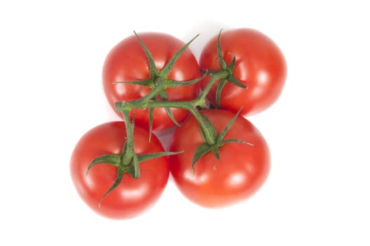 Looking straign down on four fresh tomatoes isolated on white background