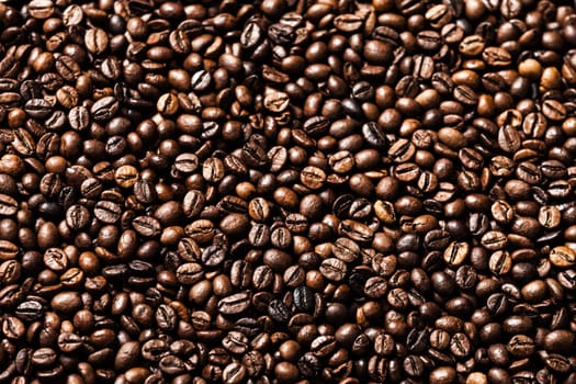 Brown roasted raw coffee bean heap background