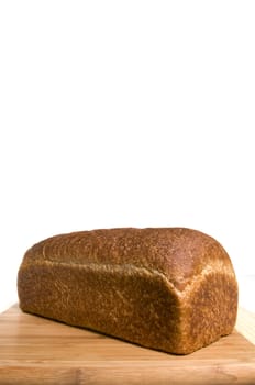 Whole wheat baked bread with large copy area on this vertical image