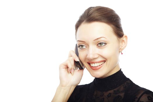 Smiling lady talking via cell phone on a white background