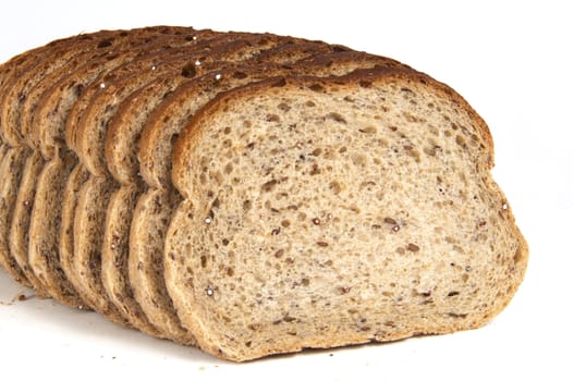 Sliced golden grain rye bread isolated on white background