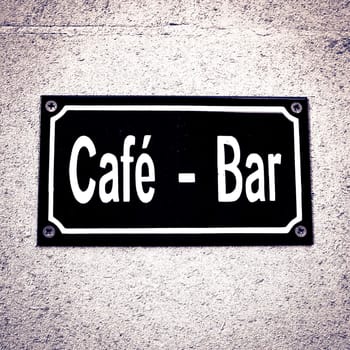 Sign for a cafe-bar with dramatic lighting and contrast