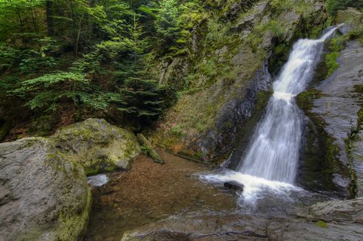 Shot of the fall of water. Stream Huntava - natural area - nature preserve.
Resov, Czech republic, Europe.