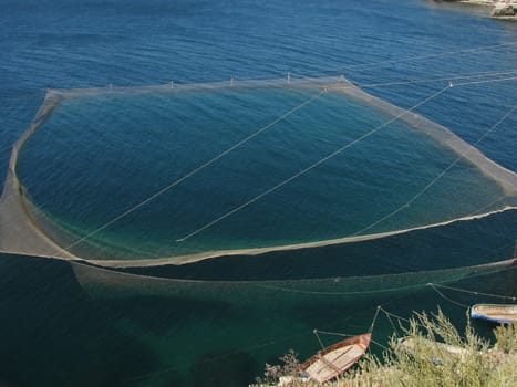 huge fishing net in sea near coast