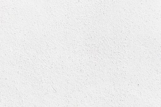 rough textured speckled wall painted white ideal as a background