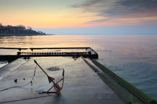 Sunset on the Tejo river with small pier.