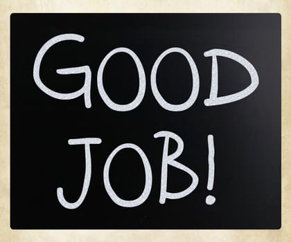 "Good job!" handwritten with white chalk on a blackboard
