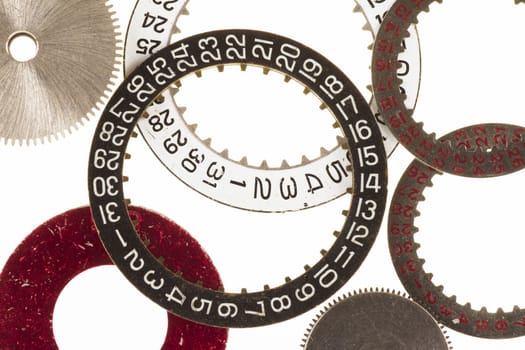 Watch cogs and date wheel or ring on white background