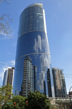 ultra-modern building in downtown Vancouver,which reflects the skyscrapers