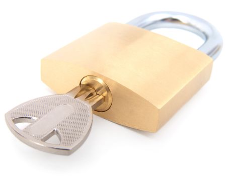 golden closed padlock with key 