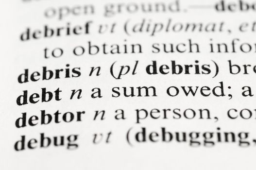 Selective focus on the dictionary word "debt"