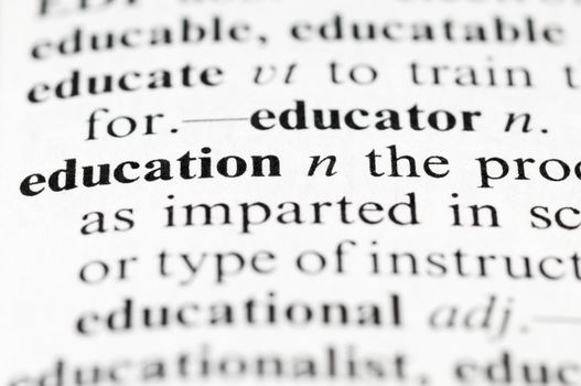 Dictionary macro photo with selective focuse on the word Education