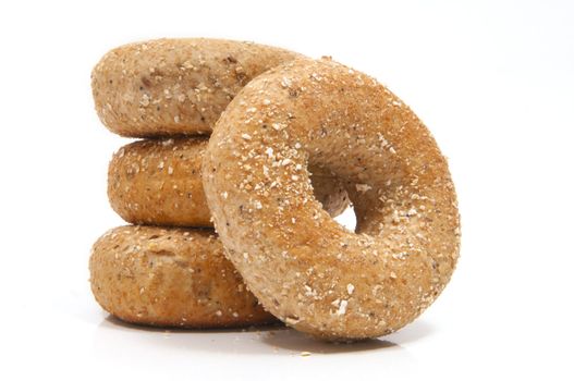 Four "Twelve Grain Bagels" with selective focus on the foreground bagel