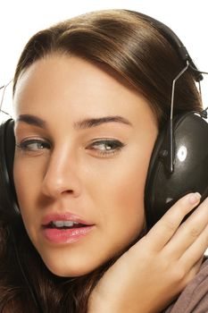closeup of a beautiful woman listening to music