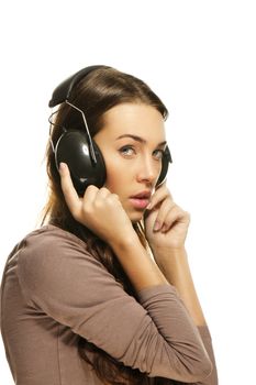 shy woman with headphones on white background