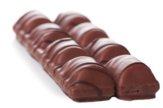 Closeup view of chocolate bars over white background