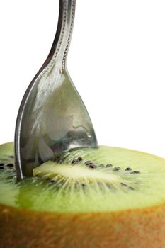 Closeup view of teaspoon in a kiwi fruit