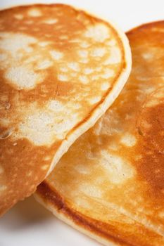 Closeup view of two pancakes on a plate