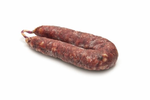 Iberian pork sausage acorn on white background