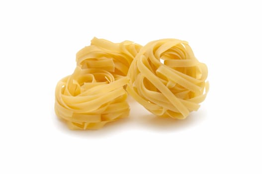 Italian pasta tagliatelle on white background