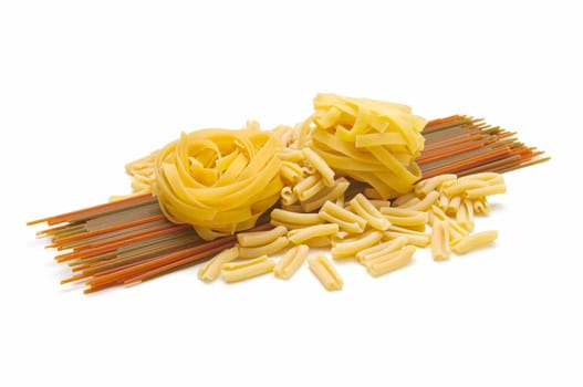 Italian pasta tagliatelle and spaghetti on white background