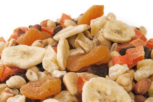 Mountain of Trail Mix with copy space white at the top with selective focus on the center area of the dried fruit and nuts