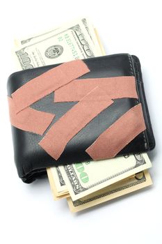 Money in Wallet with Medical Plaster on it using for Money Insurance Concept