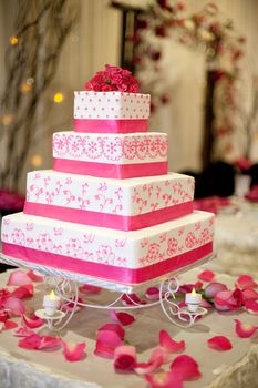 Four layer square wedding cake. Pink and white.