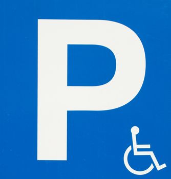 blue handicap parking sign with wheelchair symbol  