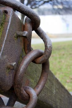 Photo of old rusted marine anchor chain.