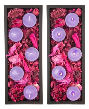 gorgeous purple candles setting with dry petal roses and other flowers on a black tray (turned off and on picture, isolated on white background)