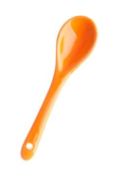 orange porcelain spoon isolated on white background