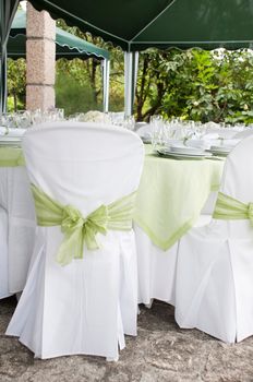 gorgeous wedding chair and table setting for fine dining at outdoors