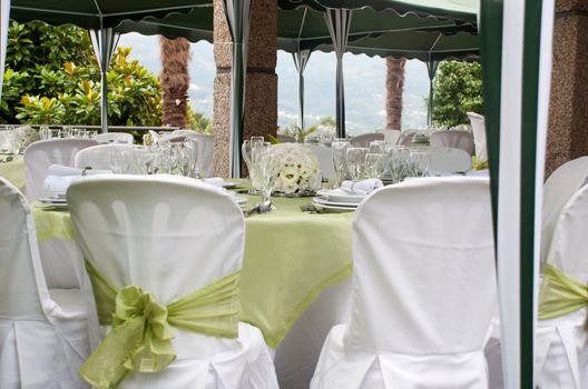 gorgeous wedding chair and table setting for fine dining at outdoors