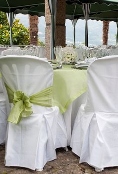 gorgeous wedding chair and table setting for fine dining at outdoors