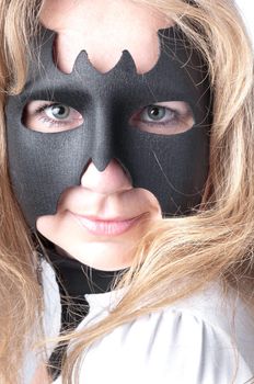 young and beautiful girl in the costume of a black bat