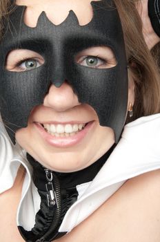 young and beautiful girl in the costume of a black bat
