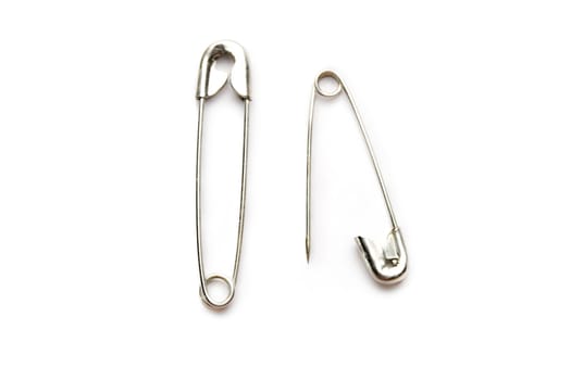 Safety pins isolated on the white background