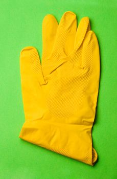 Glove isolated on green backgroun