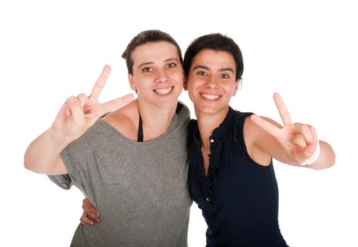 happy smiling sisters showing victory hand sign, isolated on white background