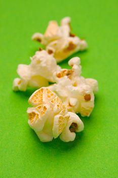 Popcorn isolated on green