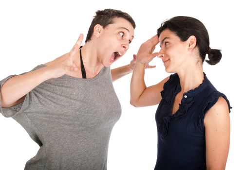 angry sisters in their 30s arguing and yelling with each other, isolated on white background