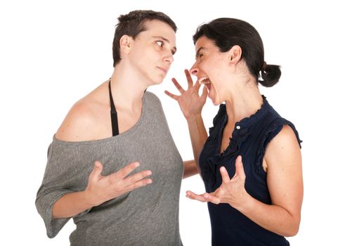 angry sisters in their 30s arguing and yelling with each other, isolated on white background