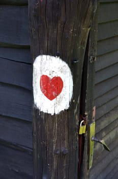 Love heart painted on a wooden hut