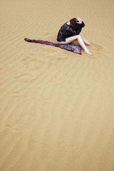 Lonely depressive woman lost in the hot desert