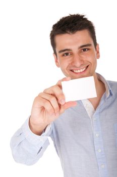 smiling young casual man holding blank white card (focus on hand, isolated on white background)