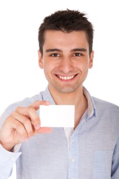 smiling young casual man holding blank white card (isolated on white background)