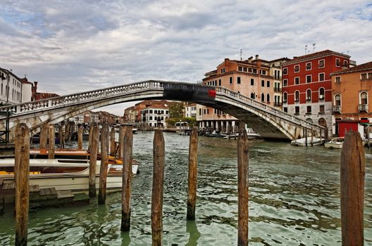 Venice, Italy- July 29th, 2011: Venetian cityscape located near the Ponte degli Scalzi in the vicinity of railway station.Venice is a special city in Italy,built in an archipelago of 117 islands formed by 177 canals in a shallow lagoon, connected by 409 bridges.